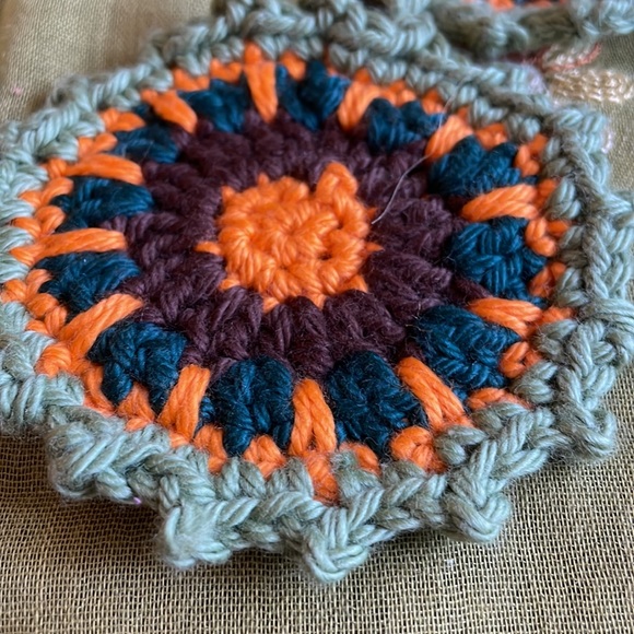 Hand crocheted Mandala coasters in sage green, orange, dark teal and brown. - Picture 4 of 6